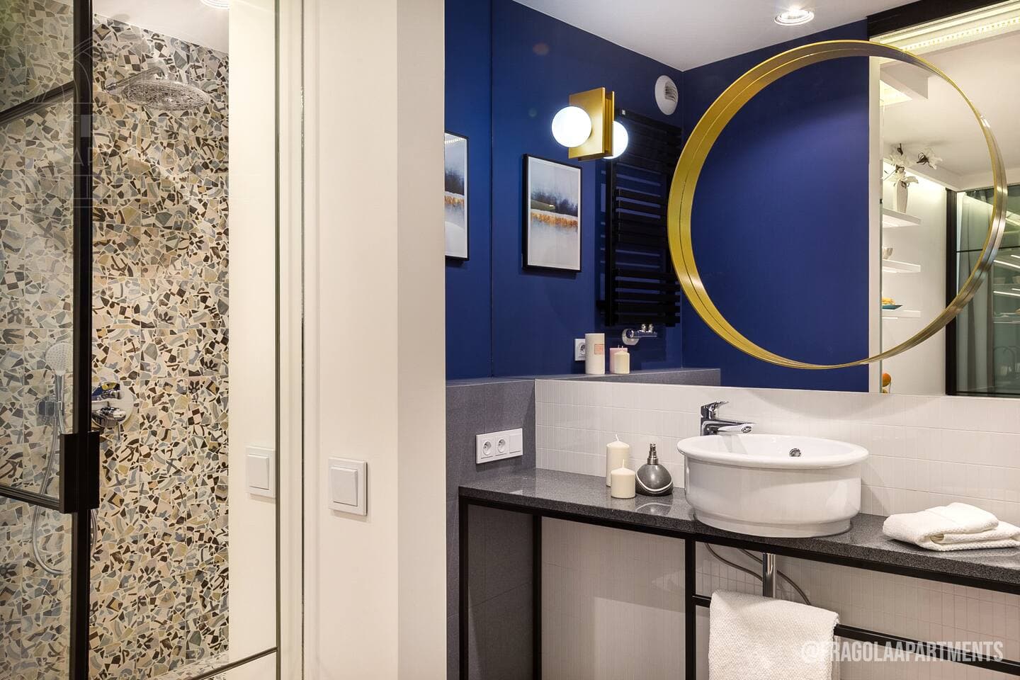 The vanity space with a sleek sink combines functionality and style, providing a sophisticated area for personal grooming and daily routines.